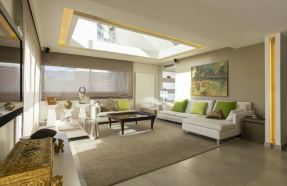 living room with white sofa and brown wooden coffee table